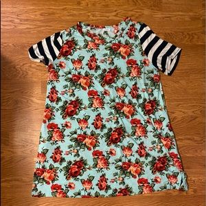 Floral tunic with navy and white striped sleeves